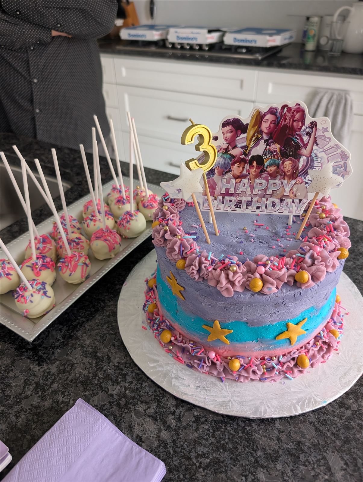 K-Pop Demon Hunters cake with matching cake pops