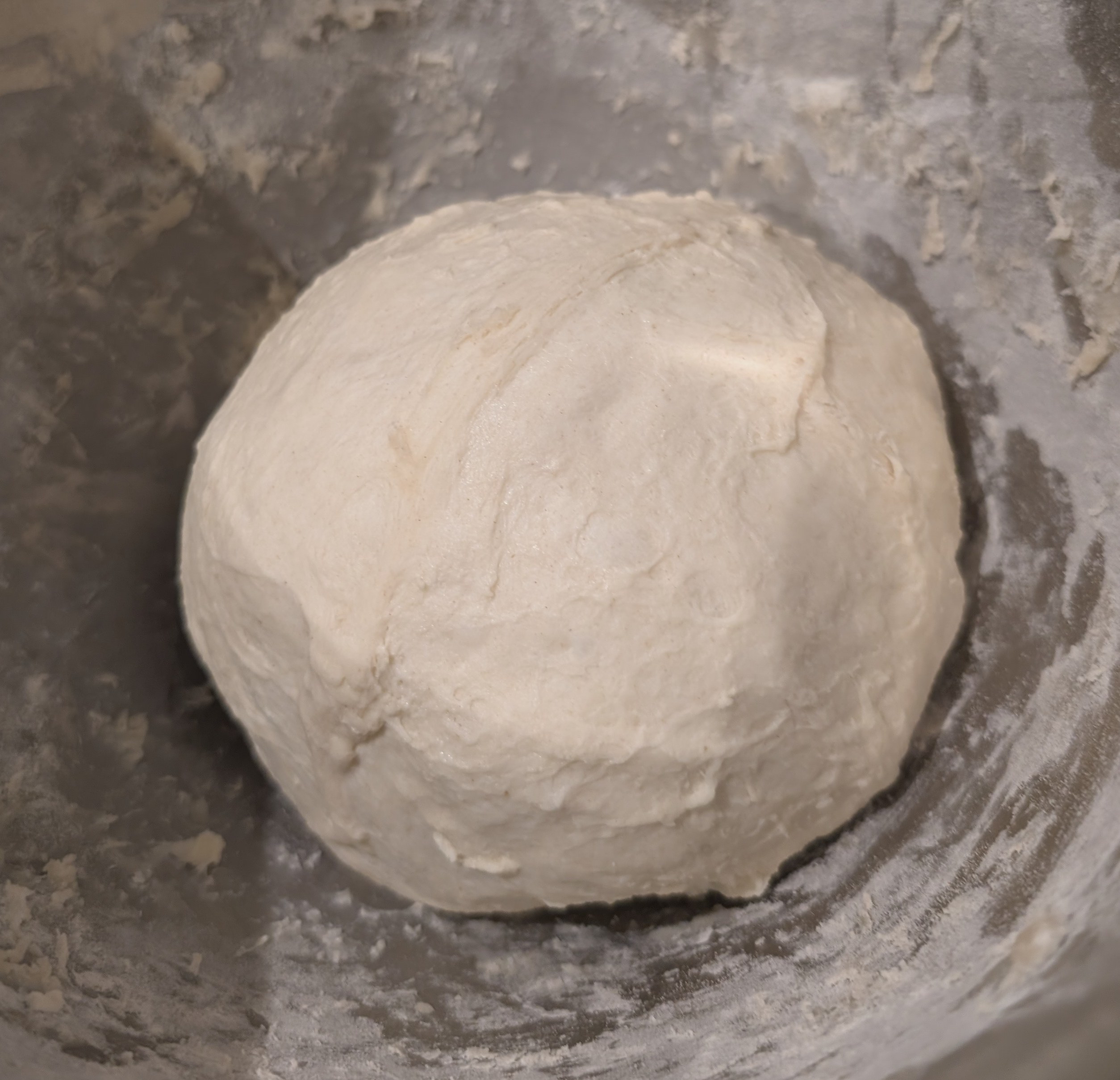Dough shaped into a smooth ball after the third stretch and fold