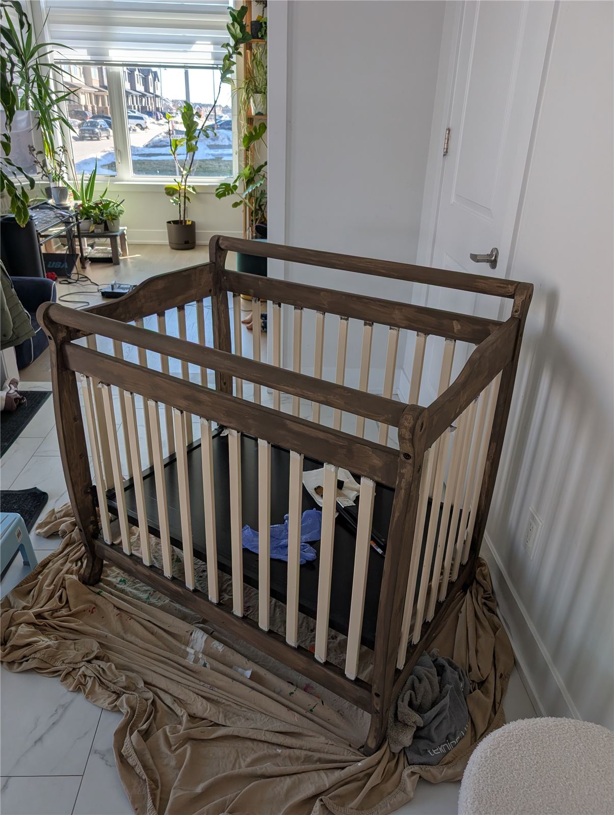 Mini crib after applying milk paint and hemp oil top coat, with a weathered wood finish
