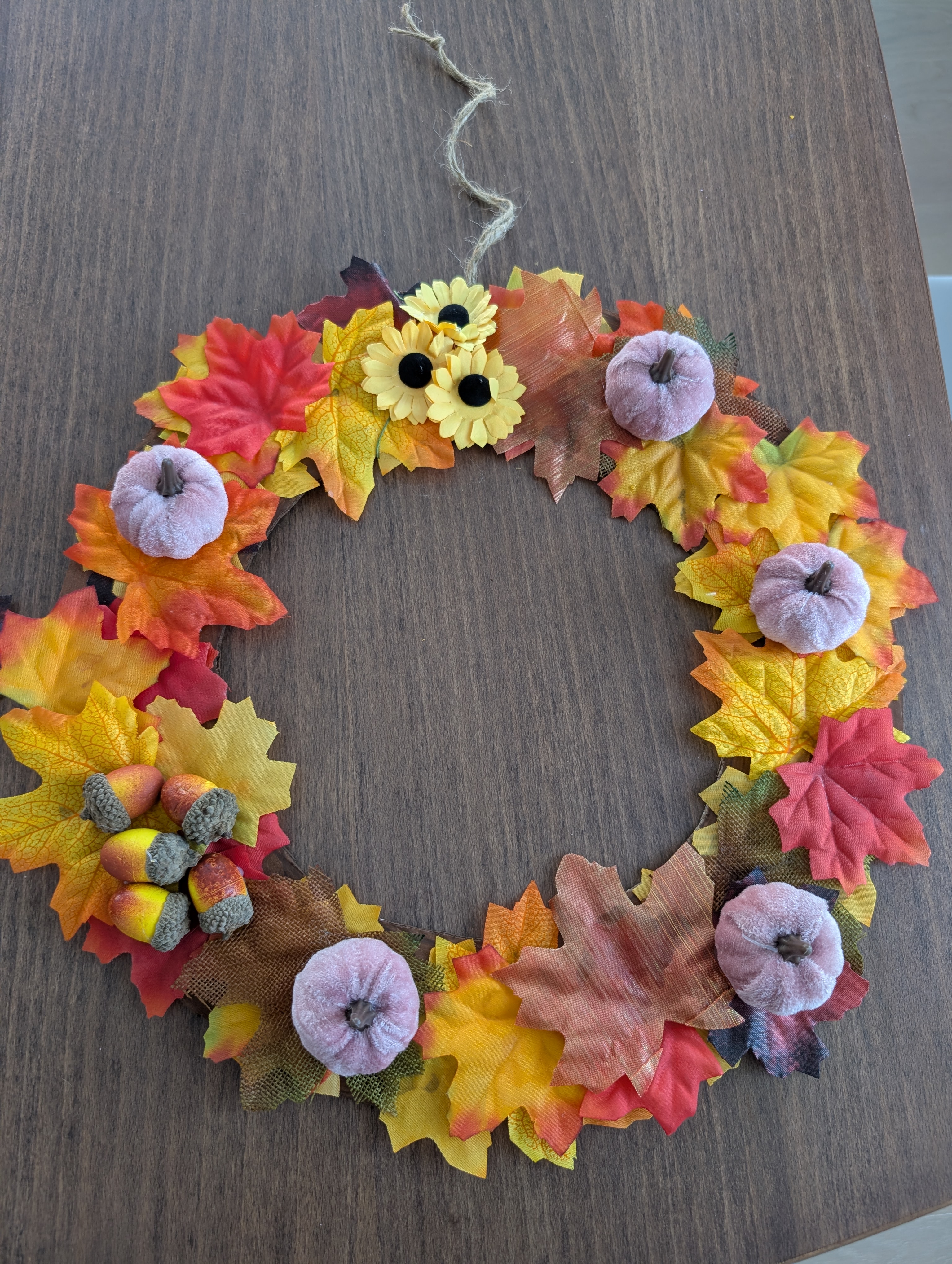 Finished Dollar Tree fall leaf wreath with velvet pumpkins and acorns