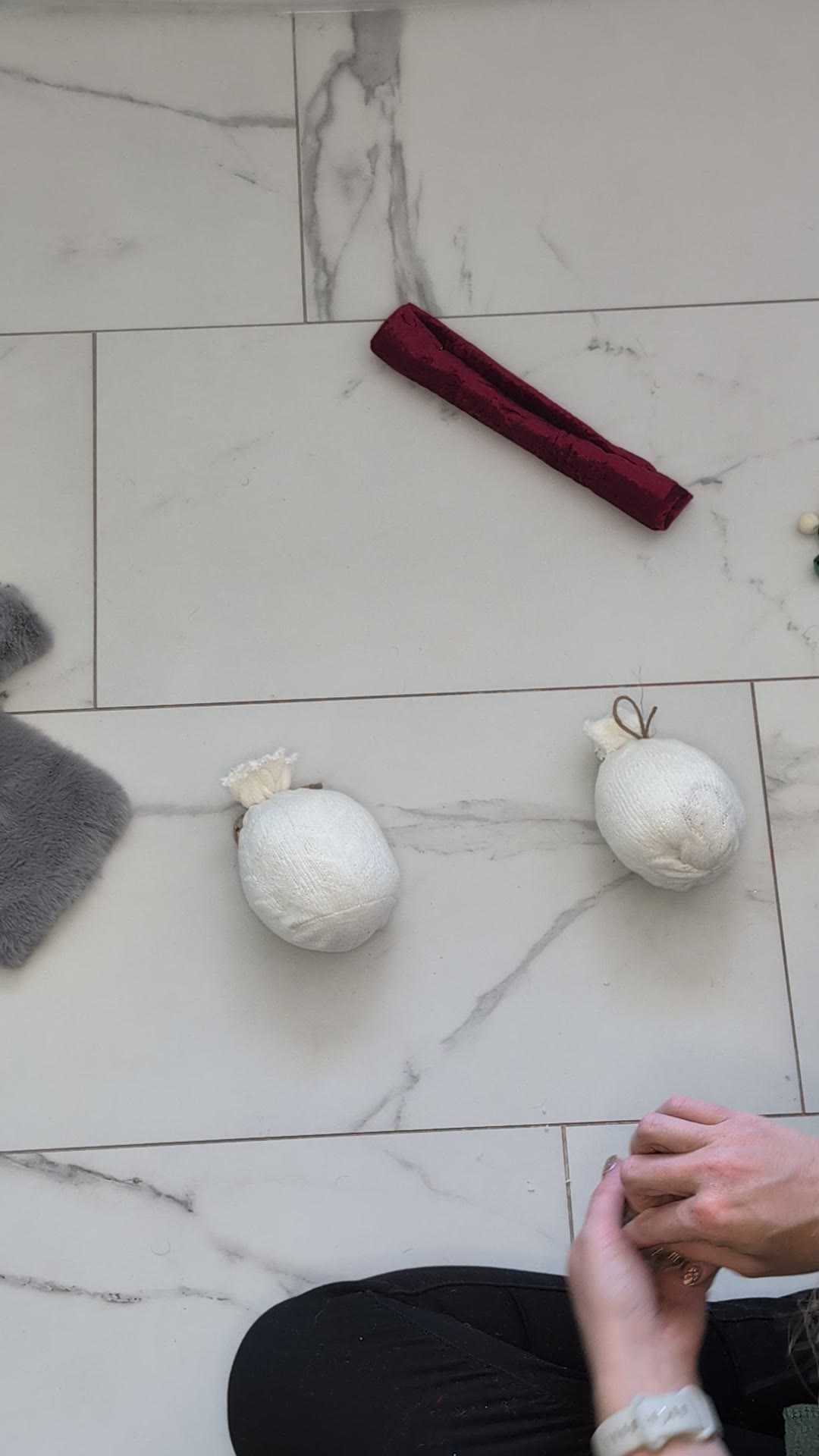Two stuffed socks tied off with twine, ready for the beard