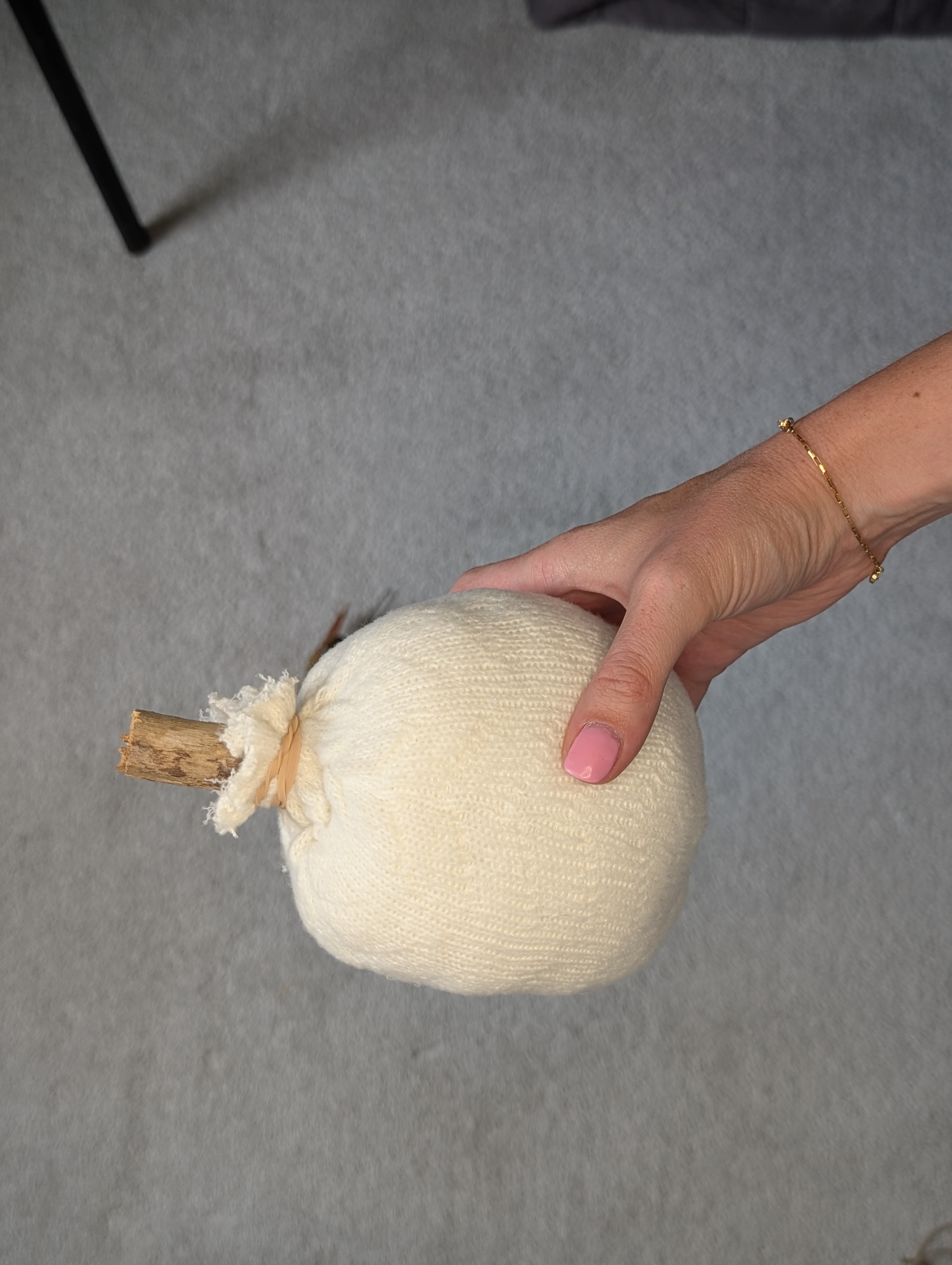 Stuffed sock with a branch stem held in place by an elastic