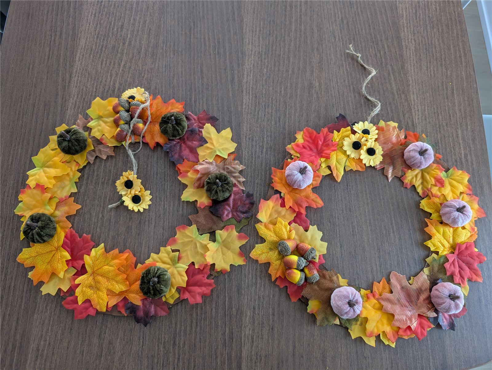Finished DIY fall leaf wreath with velvet pumpkins and acorns